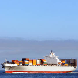 Container Ship at Sea by Olivier Le Queinec