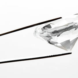 Diamond In Jewelers Tweasers by William Andrew