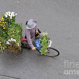 Flower seller in street of Hanoi by Sami Sarkis Photography