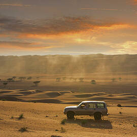 Four Wheel Driving In A Desert by Buena Vista Images