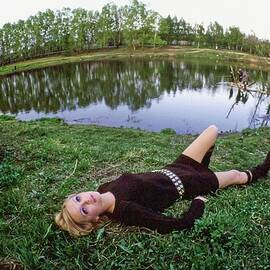 Galya Milovskaya Wearing A Brown Dress by Arnaud de Rosnay