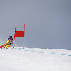 Giant Slalom Skier Rounds Gate At High by Ascent Xmedia