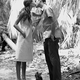 Gisele Bundchen Kissing A Young Man by Arthur Elgort