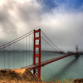 Golden Gate in The clouds by Peter Tellone
