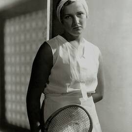 Helen Jacobs Holding A Tennis Racket by Horst P. Horst