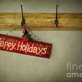 Holiday sign on antique plaster wall by Sandra Cunningham