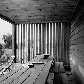 Interior End Of Porch With Vertical Louvers by P.A. Dearborn