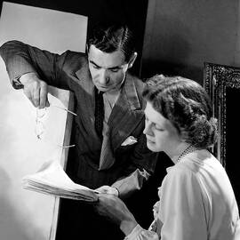 Irving Berlin Looking At Papers With His Wife by Horst P. Horst