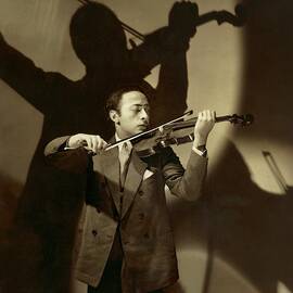 Jascha Heifetz Playing His Violin by Edward Steichen