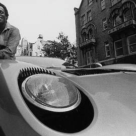 Jazz Musician Miles Davis Sitting On The Hood by Mark Patiky