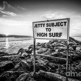 Jetty Subject to High Surf Sign Black and White Picture by Paul Velgos