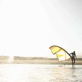 Kitesurfer On Beach At Sunset by Stanislaw Pytel