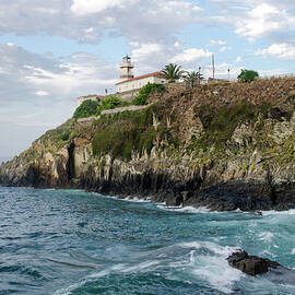Lighthouse On A Rocky Coast by Megan Ahrens