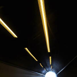 Lights inside a highway tunnel by Sami Sarkis Photography