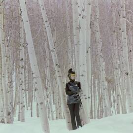 Model In Snow Among Birch Trees by Henry Clarke