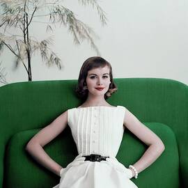 Model Phyllis Newell Sitting On A Green Sofa by Frances McLaughlin-Gill