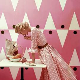 Model Putting On Lipstick by Richard Rutledge