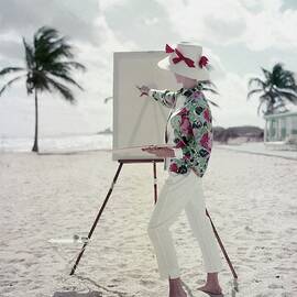 Model Standing On A Beach In Front Of An Easel by Frances McLaughlin-Gill
