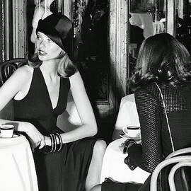 Model Wearing A Dress And Hat In Isle Of Capri by Kourken Pakchanian