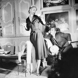 Model Wearing Dress Holding Teacup By Man by Horst P. Horst