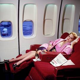 Model Wearing Pink Jacket On Airplane by Horst P. Horst