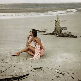 Model Wrapped In A Pink Towel On The Beach by Frances McLaughlin-Gill