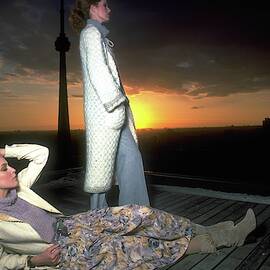 Models On A Roof At Sunset by Albert Watson