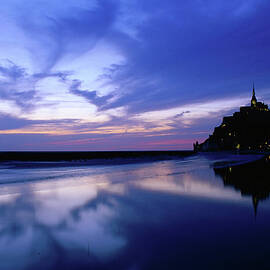 Mont St Michel Reflected In The Bay At by David C Tomlinson