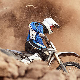 Motocross Biker Taking A Turn In The by Daniel Milchev