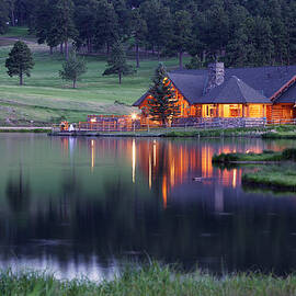 Mountain Lodge Reflecting In Lake At by Beklaus