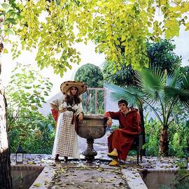 Paul And Talitha Getty By Fountain by Patrick Lichfield