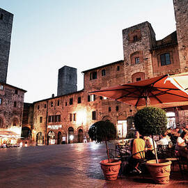 People Dining Outside Restaurants In A by Gary Yeowell