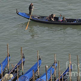 People touring Venice in gondola by Sami Sarkis Photography