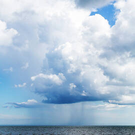 Puffy Cloud Emitting Rain by Maciej Frolow