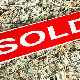 Real Estate Sold Sign over Dollar Money Background by Olivier Le Queinec