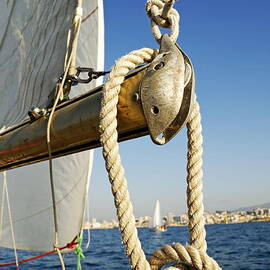 Rope on sailboat mast during navigation by Sami Sarkis Photography