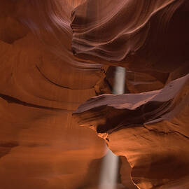 Slot Canyon Interior With Ray Of Light by John Elk
