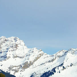 Snow Covered Mountain Peak In The Swiss by Dougal Waters