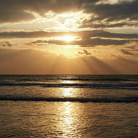 Sunburst Through Clouds Above Seascape by Dougal Waters