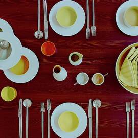 Tableware Set On A Wooden Table by Romulo Yanes