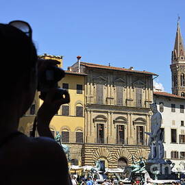 Tourist taking pictures of Florence by Sami Sarkis Photography