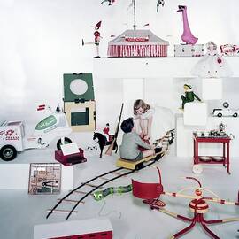 Two Children Playing With Vintage Toys by Bruce Knight