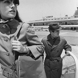 Two Models Boarding A Plane by Leonard Nones