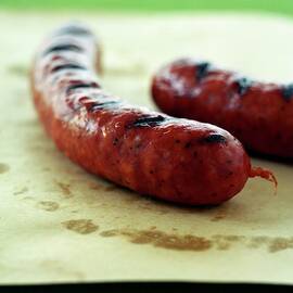 Two Spicy Sausages by Romulo Yanes