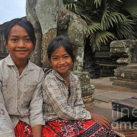 Two young cambodian girls in Angkor Wat by Sami Sarkis Photography