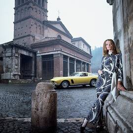 Veruschka Von Lehndorff Standing In Piazza Di San by Franco Rubartelli