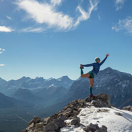 Woman Performs Yoga Move On Mountain by Ascent Xmedia
