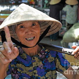 Woman portrait at market in Hue by Sami Sarkis Photography