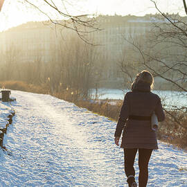 Woman Walking Along Path With by Ascent pks Media Inc.