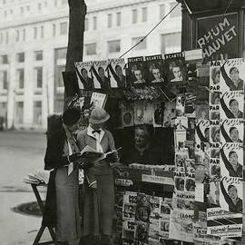 Women At A Newsstand In Paris by George Hoyningen-Huene